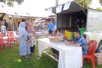 Pemerintah Kotamobagu dan Bulog Gelar Gerakan Pangan Murah di Kelurahan Motoboi Kecil, (Foto: ZONAUTARA.com/Sajidin Kandoli).