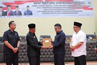 Pj. Wali Kota Kotamobagu Hadiri Rapat Paripurna DPRD Kearsipan, (Foto: Diskominfo KK).