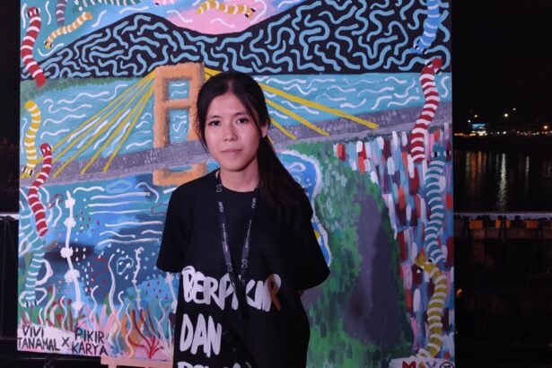 Vivi Tanamal, muralis perempuan asal Minahasa Utara, (Foto: ZONAUTARA.com/ Gitta Waloni).