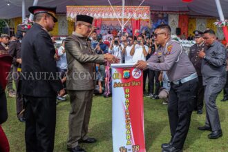 Suasana saat Penjabat (Pj) Wali Kota Kotamobagu, Asripan Nani, (tengah) menghadiri perayaan Hari Ulang Tahun (HUT) ke-78 Bhayangkara, (Foto: ZONAUTARA.com/Yegar Sahaduta).