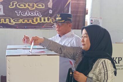 Pj Wali Kota Kotamobagu gunakan hak pilih di TPS 007 Kotobangon