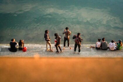 a group of people on a beach